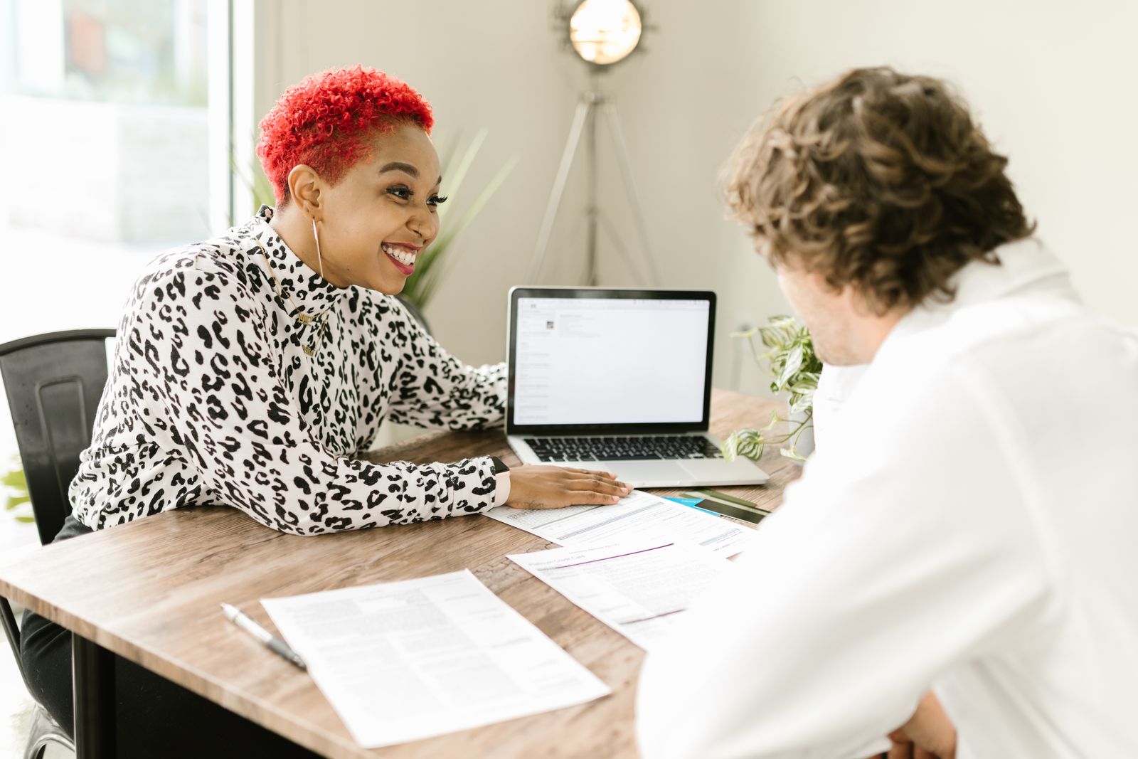 Two professionals reviewing financial documents together
