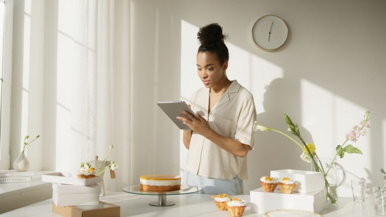 Small bakery owner reviewing orders on a tablet