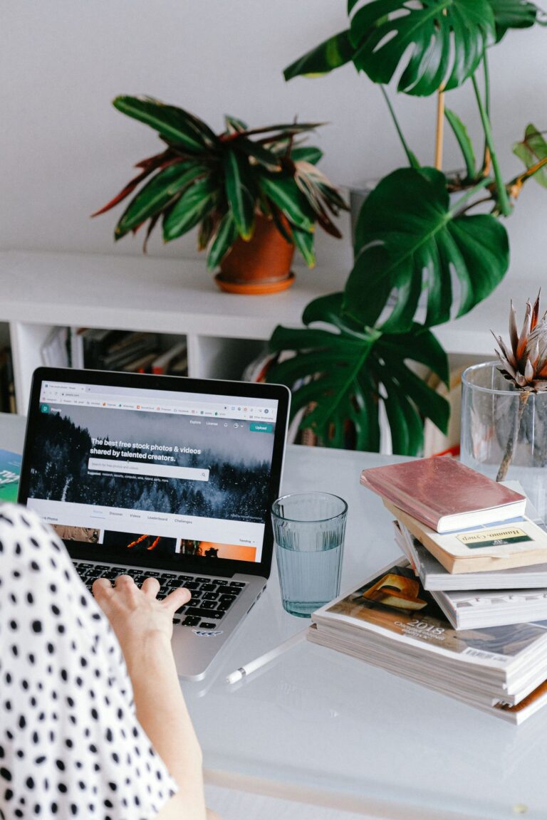 Woman working from a home office on a laptop