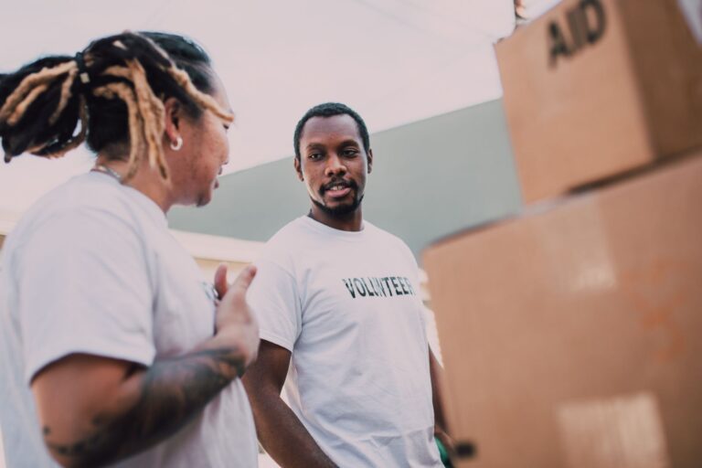 Volunteers organizing aid packages at a community event