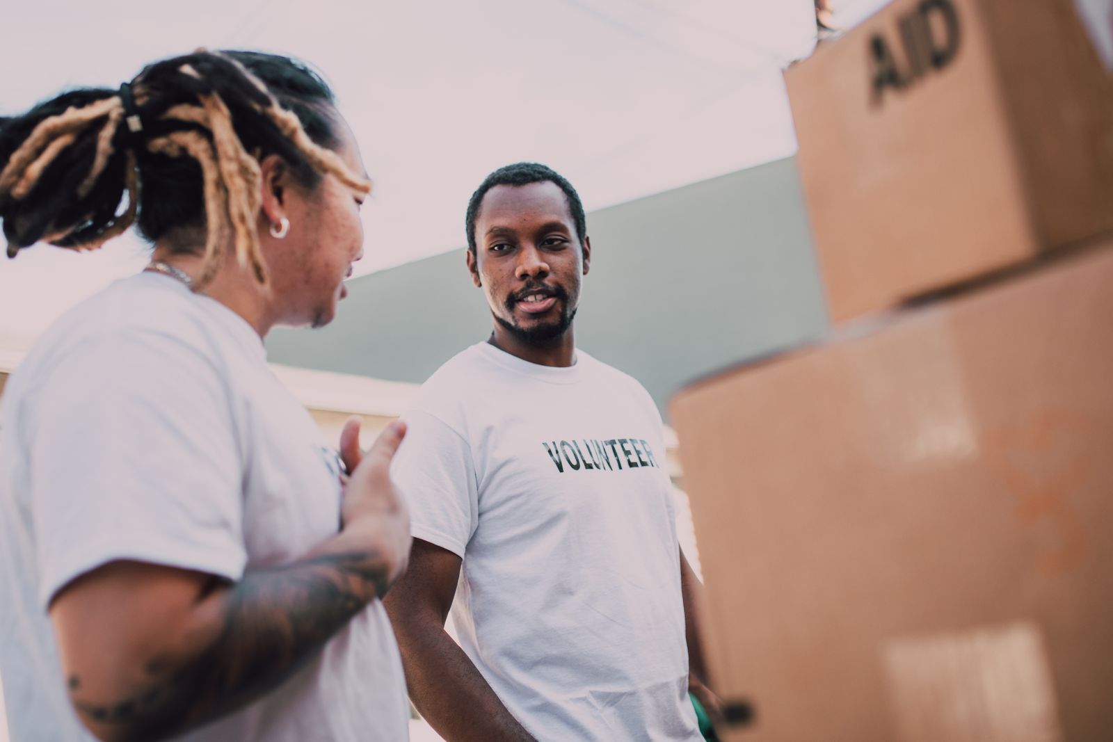Volunteers organizing aid packages at a community event